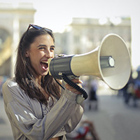 Marketing person announcing campaign using megaphone